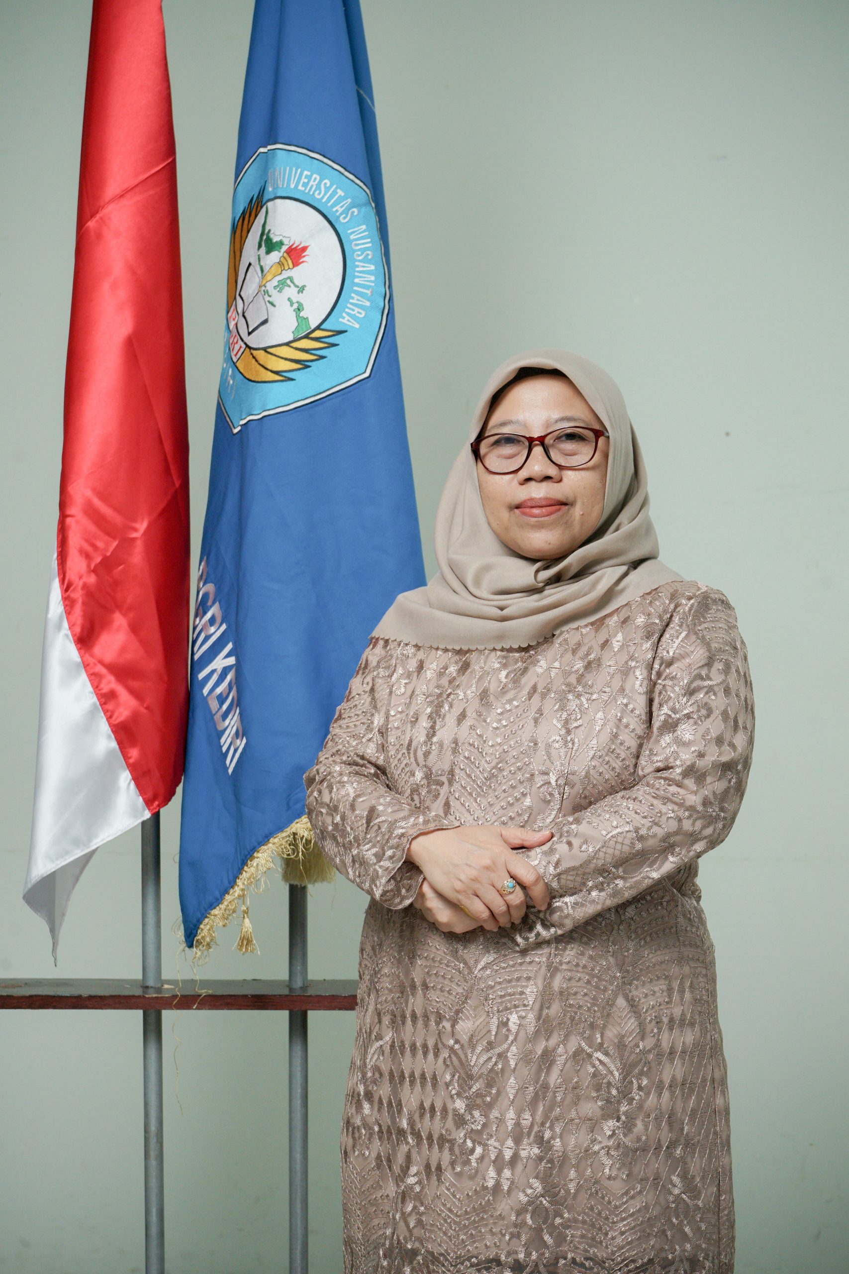 Dra. Elis Irmayanti, M.Pd.